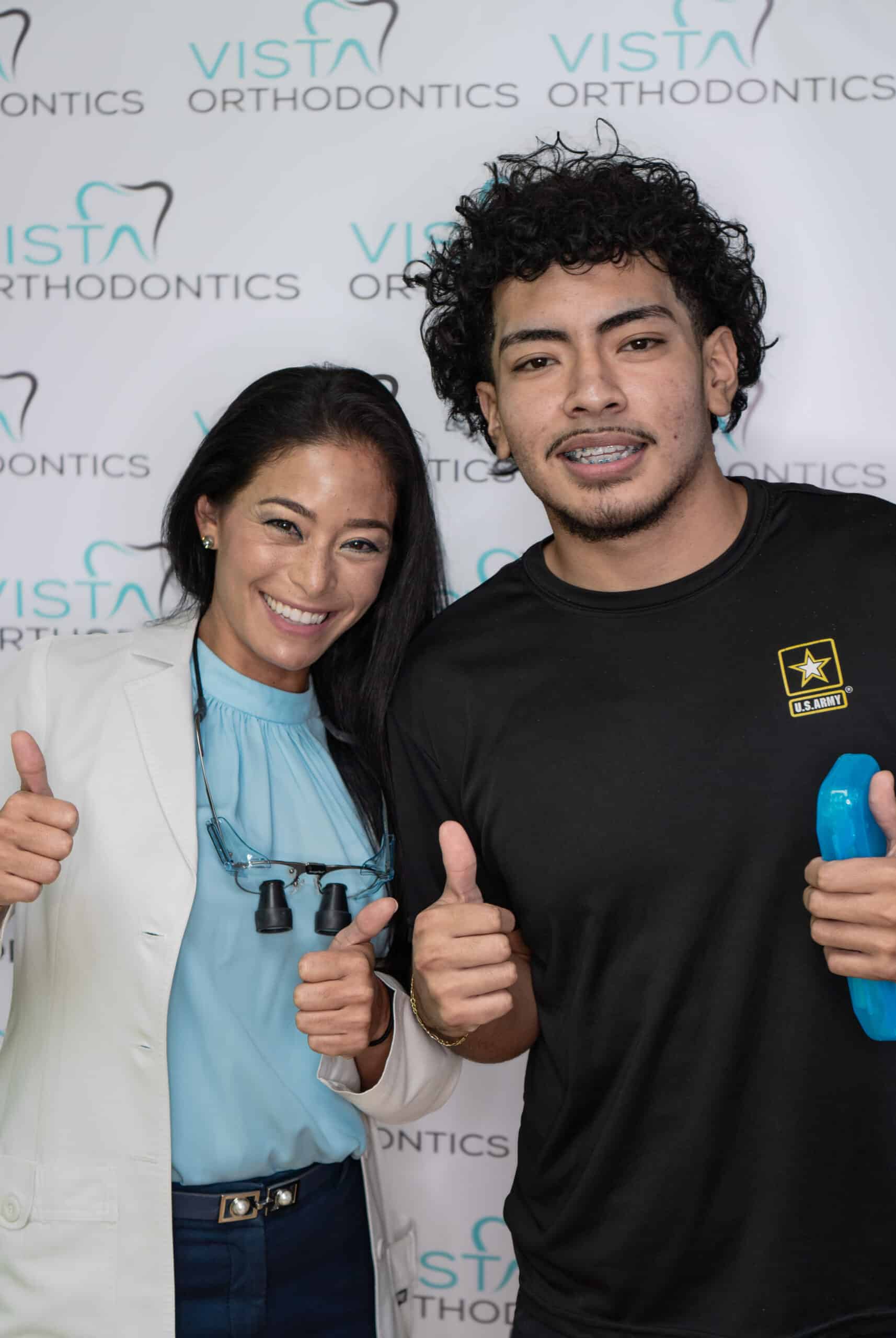 a man and woman holding thumbs up