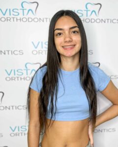 Girl with straightened teeth smiling for photo