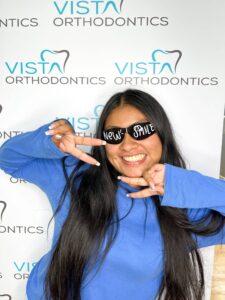 Girl excited about her straightened teeth posing for camera
