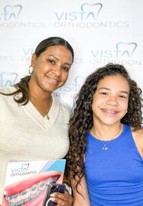 Woman and girl smiling for camera
